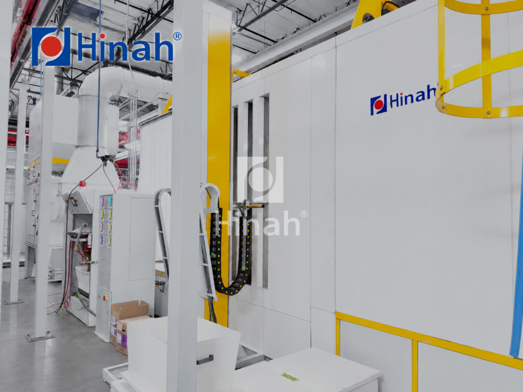 Curing oven entrance with conveyor on a powder coating line