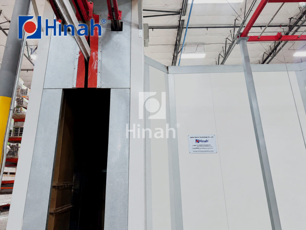 Powder coating oven opening at the exit of the booth